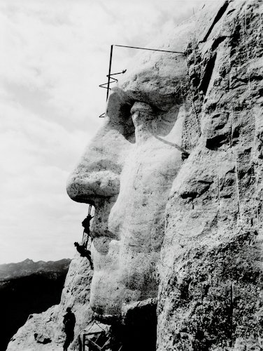 Construction at Mount Rushmore of George Washington's likeness. (Wikimedia Commons)