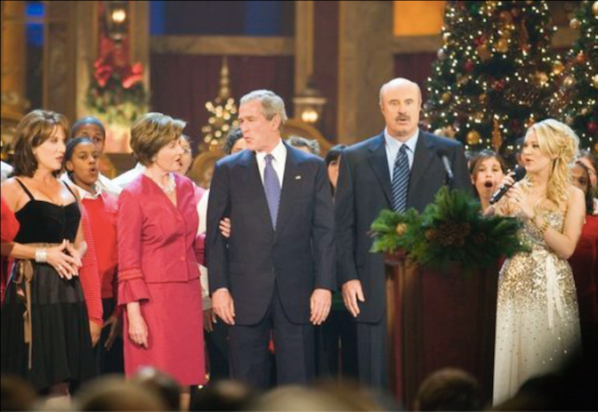 George and Laura Bush singing carols with celebrities in Washington. Source: National Archives