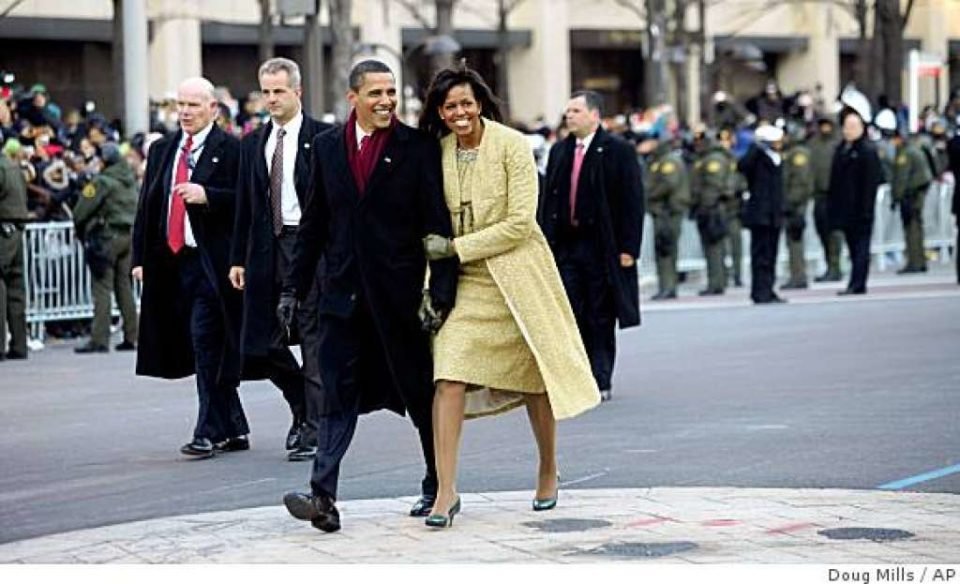 President Barack Obama and first lady Michelle Obama walk down Pennsylvania Avenue en route to the White House, Tuesday, Jan. 20, 2009, Washington. (AP Photo/Doug Mills, Pool)