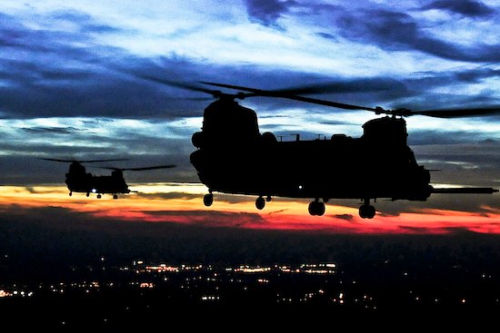 U.S. Army CH-47 Chinook helicopters continue a mission after being aerially refueled. (Wikimedia Commons)