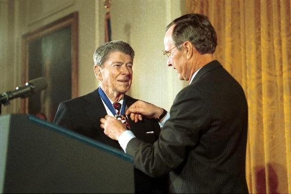 Ronald Reagan receiving the Medal of Freedom from President George H.W. Bush (Wikimedia Commons)